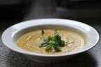 Carrot soup with a parsley garnish