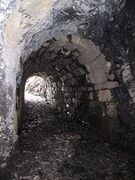 Transition from the rock to cut masonry arch inside the tunnel, picture from the south.