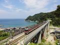 View of the Amarube railway bridge with a KiHa 189 series train