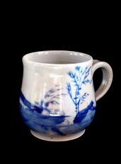 Mug with blue underglaze decoration on porcelain.