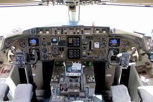 View of a 757 cockpit with six paired color displays.