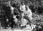 The couple with their maid Rut and dogs in a garden