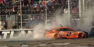 a driver performs doughnuts in their car