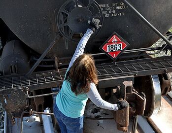 Type E double-shelf coupler on a tank car. The double shelf holds the pair of couplers in place in a derailment, which reduces the chance of the coupler puncturing the tank.