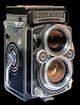 Rolleiflex twin-lens reflex camera, on black background