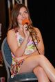 Voice actress Cassandra Morris wearing a casual minidress during a public interaction.