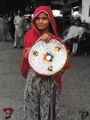 A girl selling traditional Sindhi Pindi/Dabeki