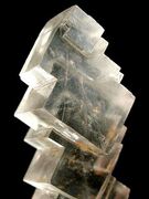 Crystals: cube-shaped crystals of halite (rock salt); cubic crystal system, isometric hexoctahedral crystal symmetry