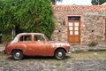 Old car parked on Calle Real in the historic district